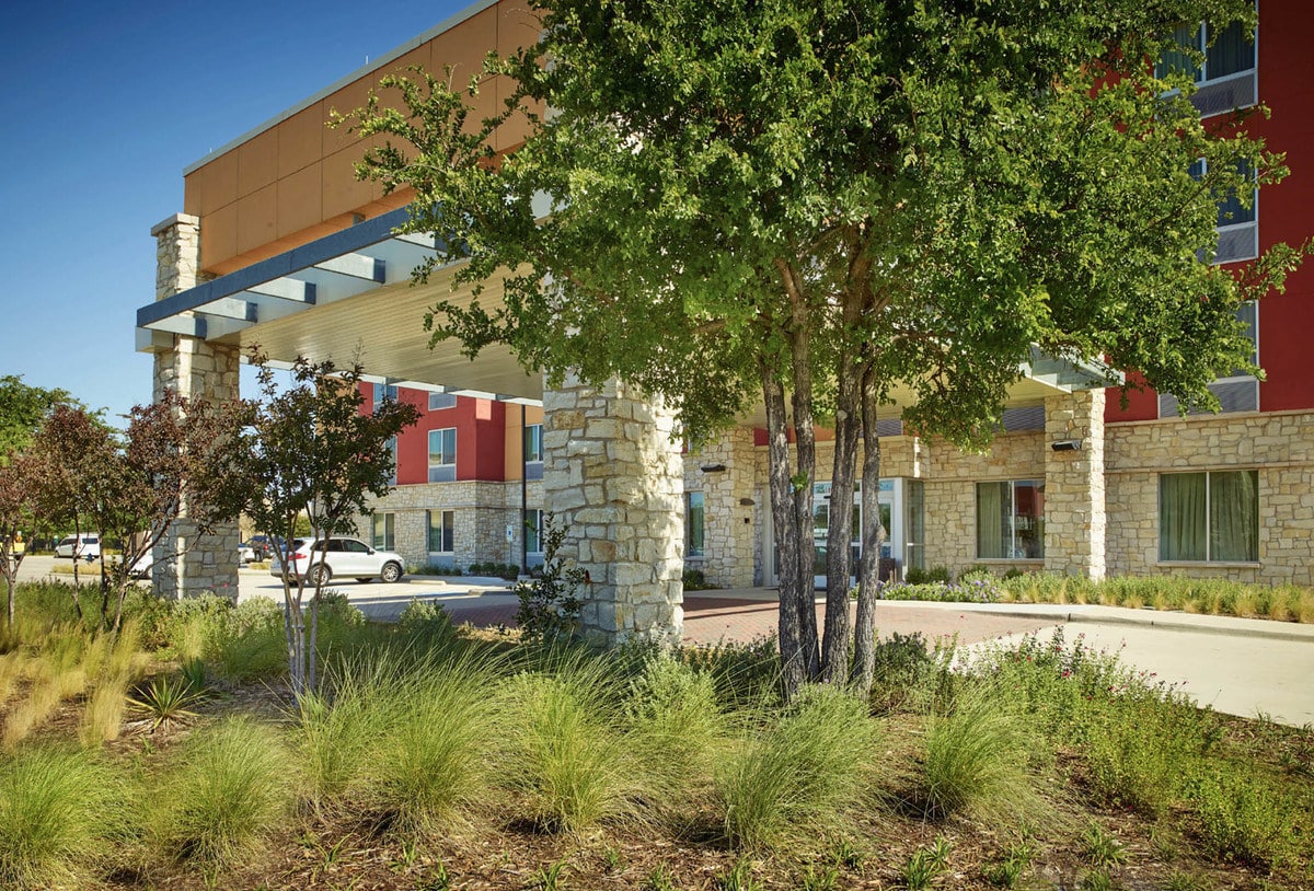 Commercial landscape design for Cascades Fairfield Inn & Suites in the Colony TX